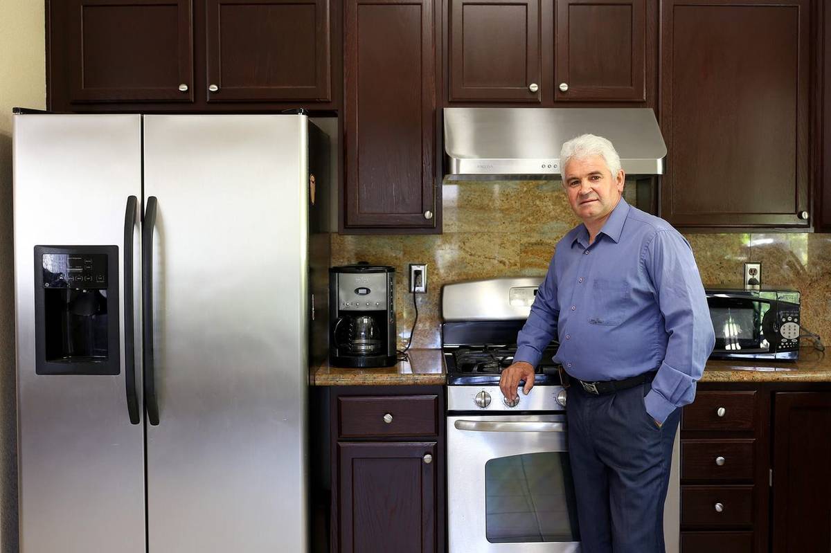 MVI Appliance Services owner in a client's kitchen